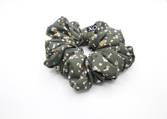 Green floral scrunchie with 'XO' on a white background