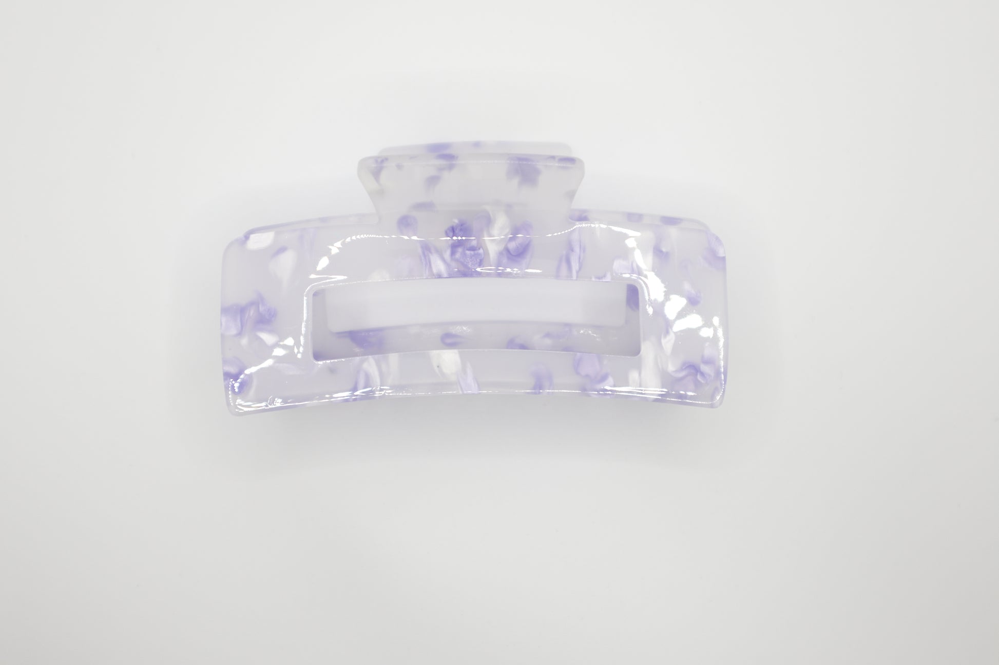 Clear hair clip with purple floral pattern on a white background 4" claw clip