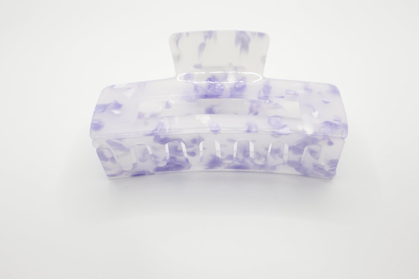 Marble-patterned 4" hair claw clip with purple and Clear design on a white background