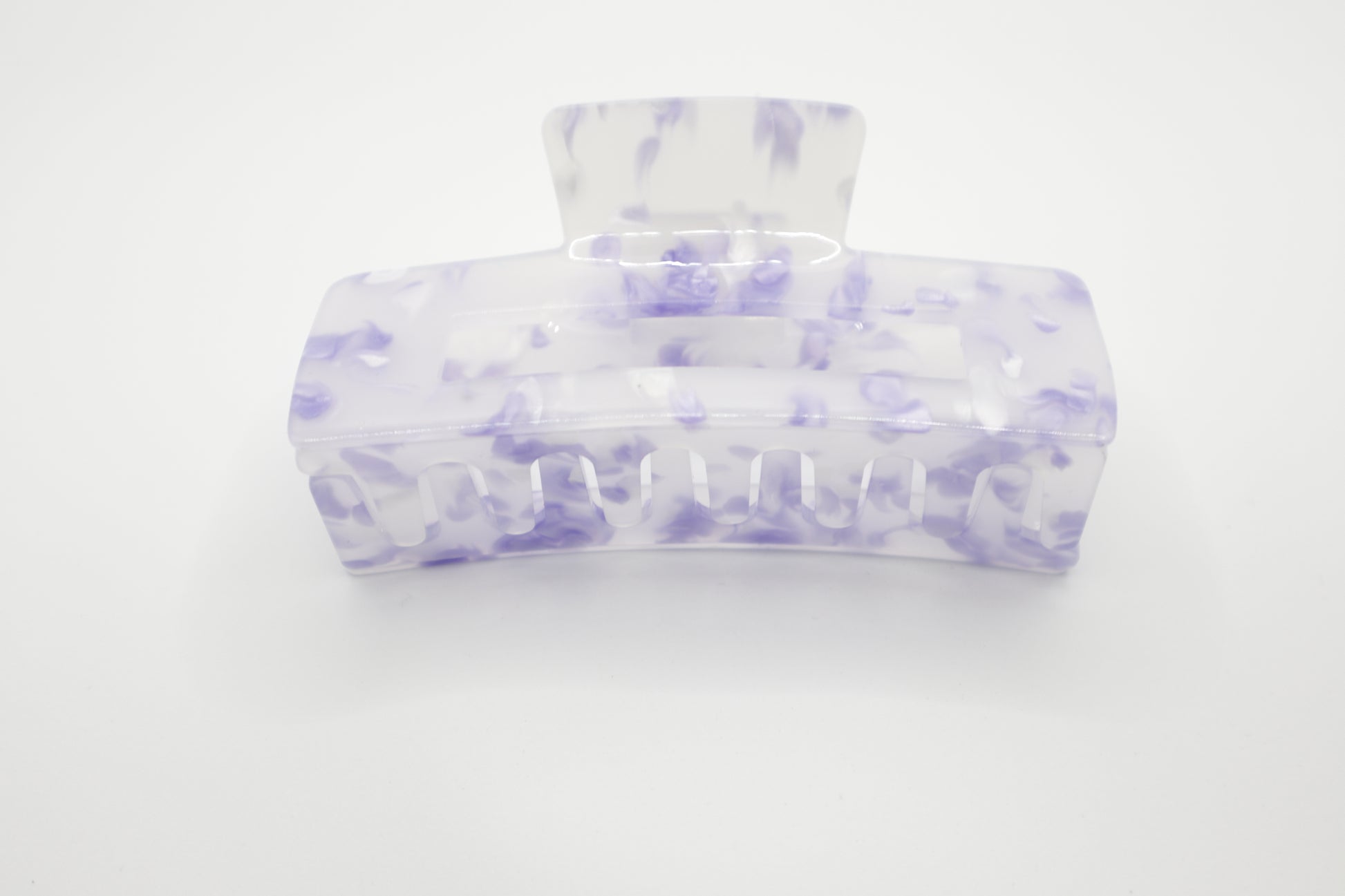 Marble-patterned 4" hair claw clip with purple and Clear design on a white background