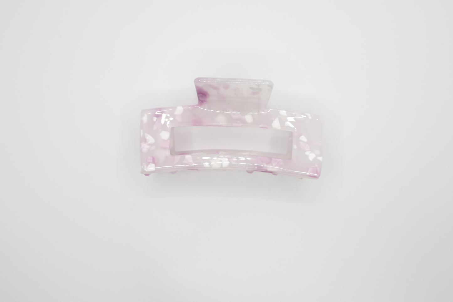 Pink hair clip on a white background