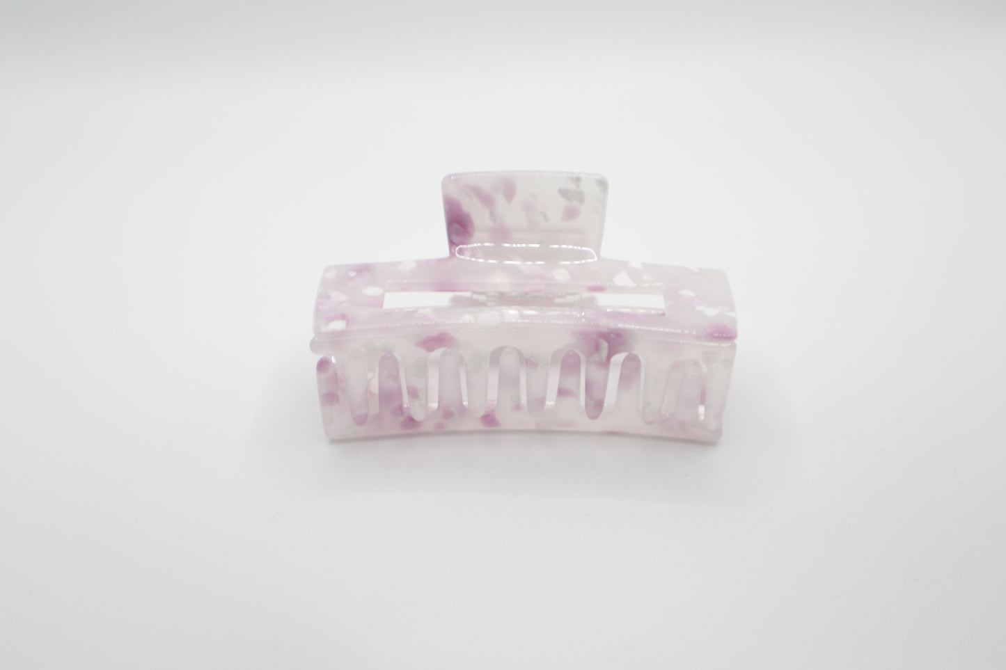 Marble-patterned hair clip on a white background