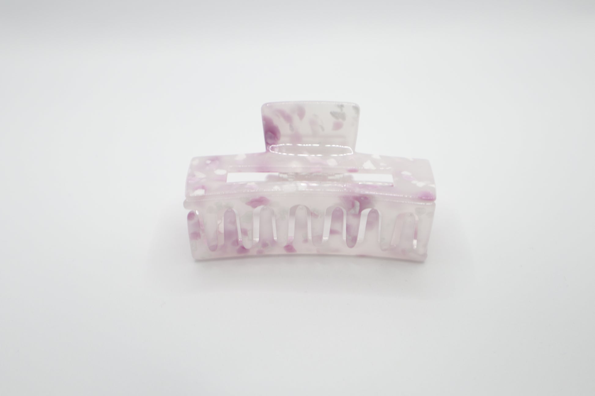 Marble-patterned hair clip on a white background