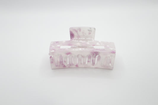 Marble-patterned hair clip on a white background