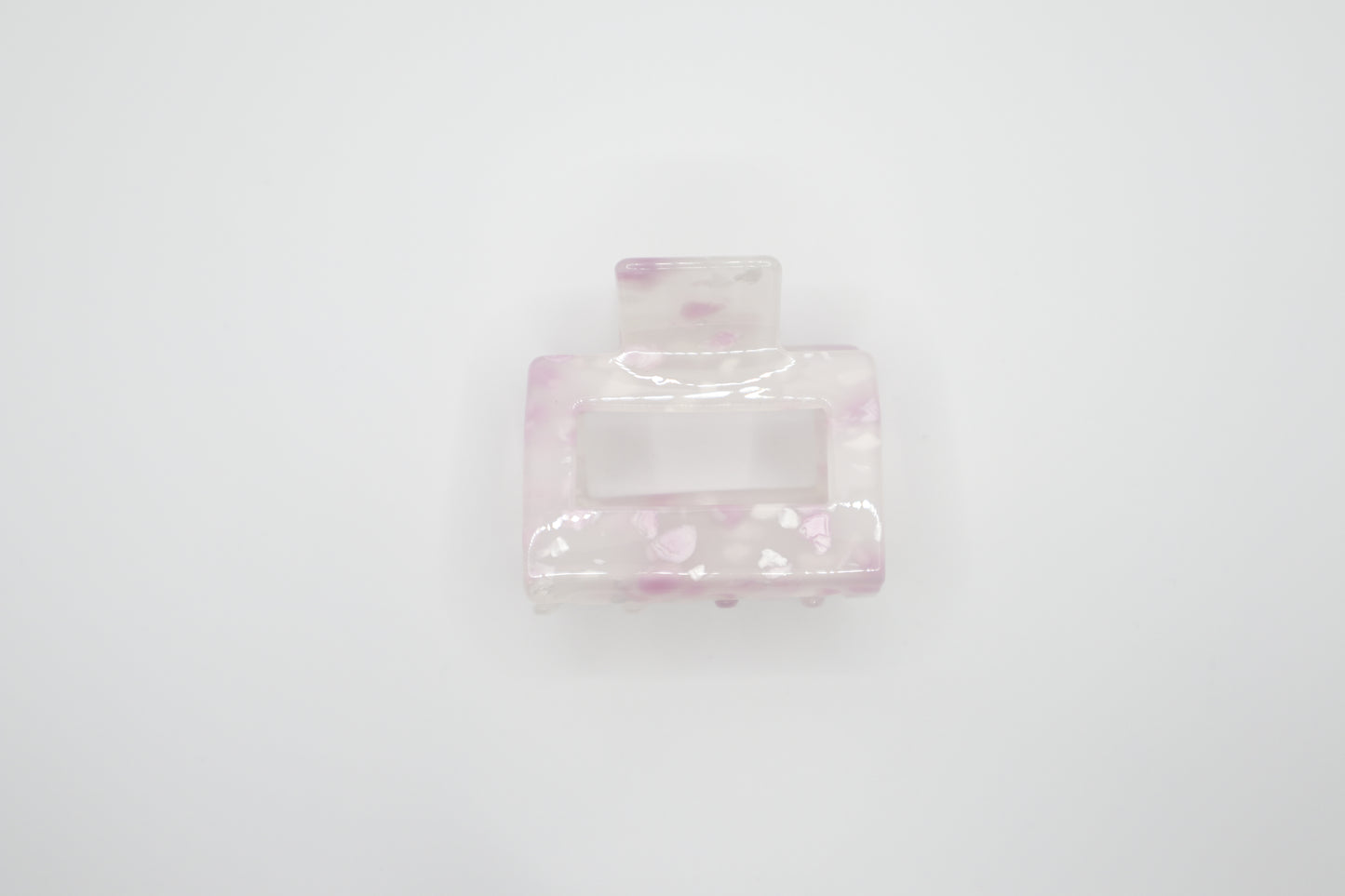 Pink hair clip on a white background