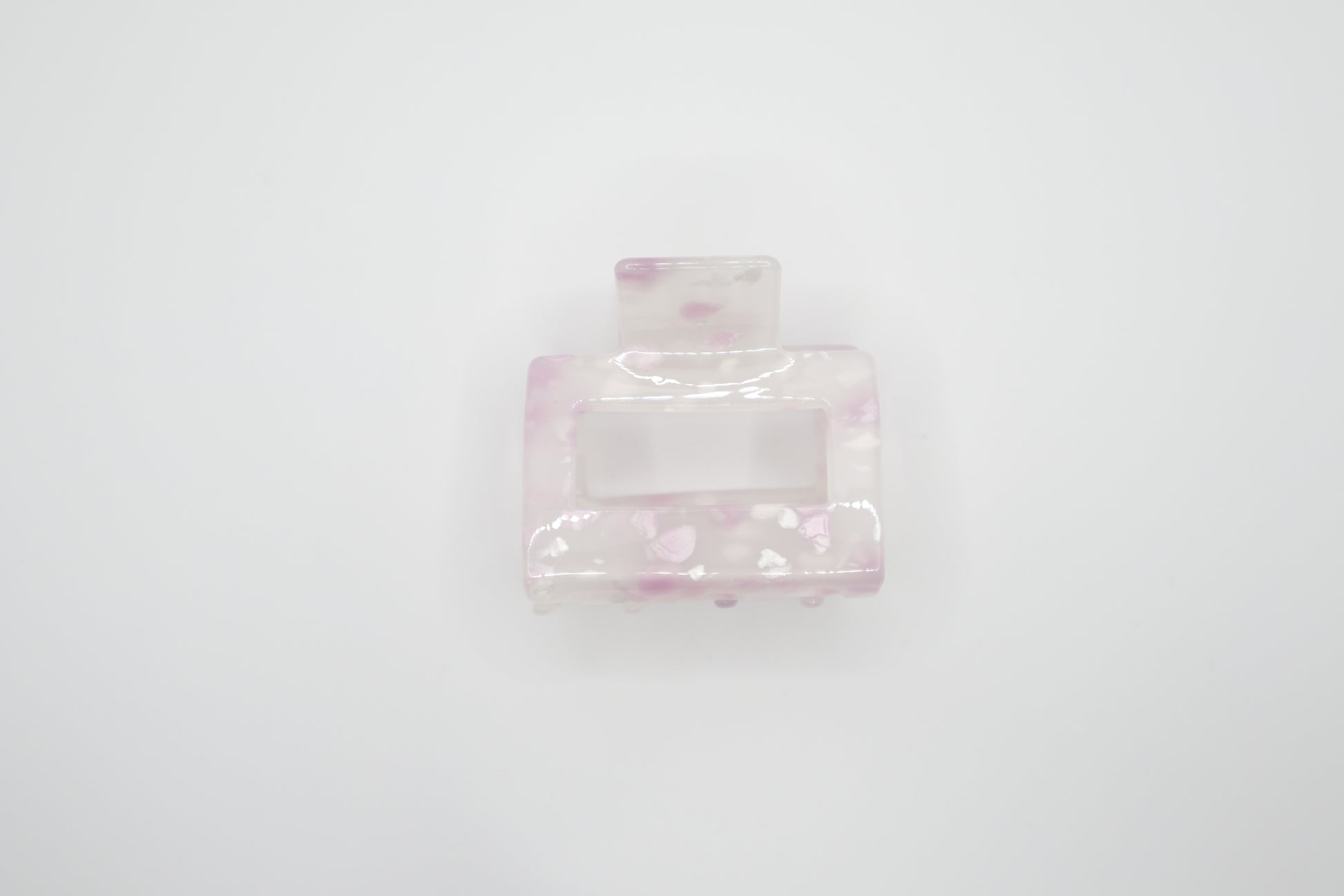 Pink hair clip on a white background