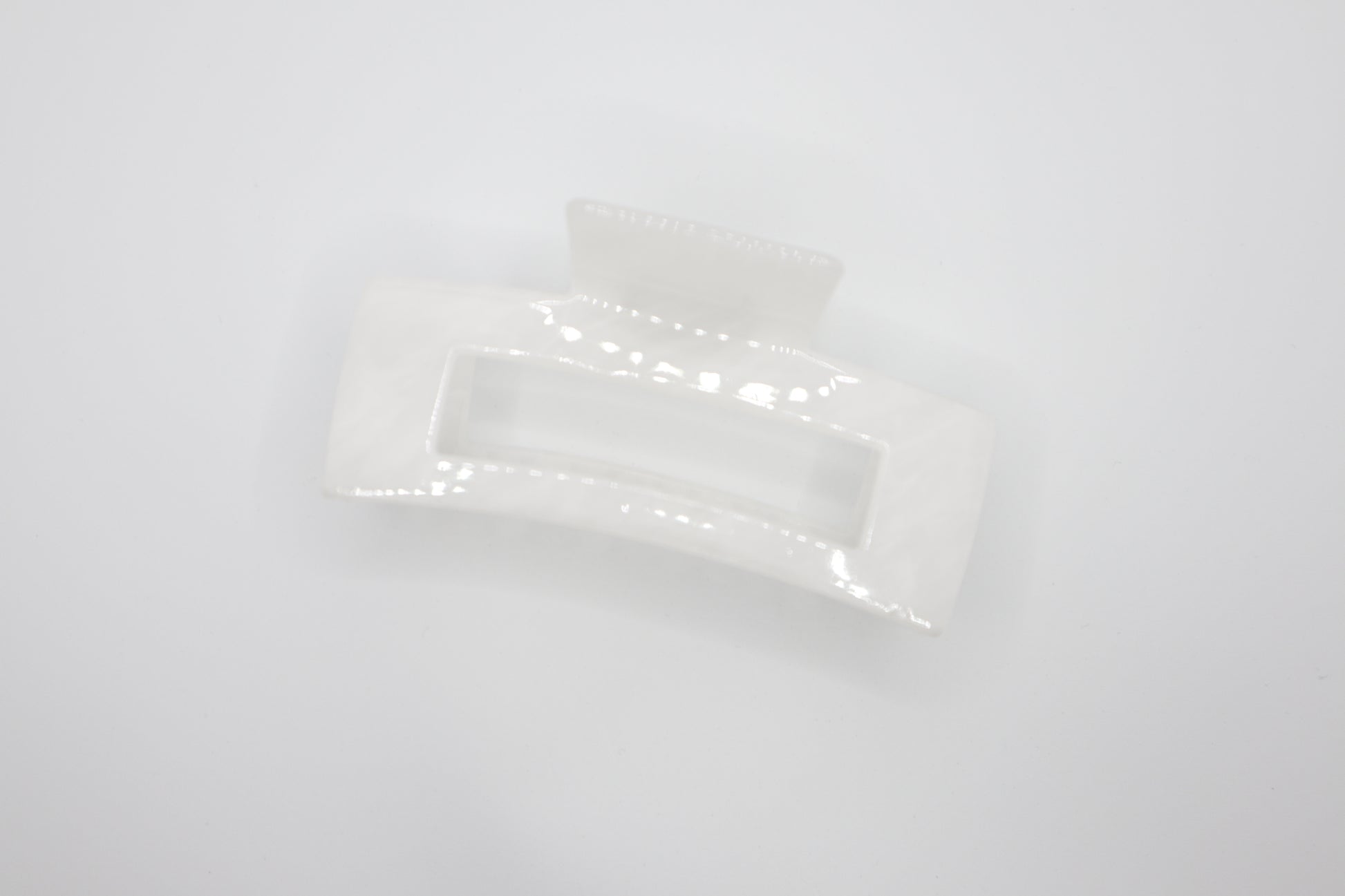 White rectangular hair claw clip on a white background