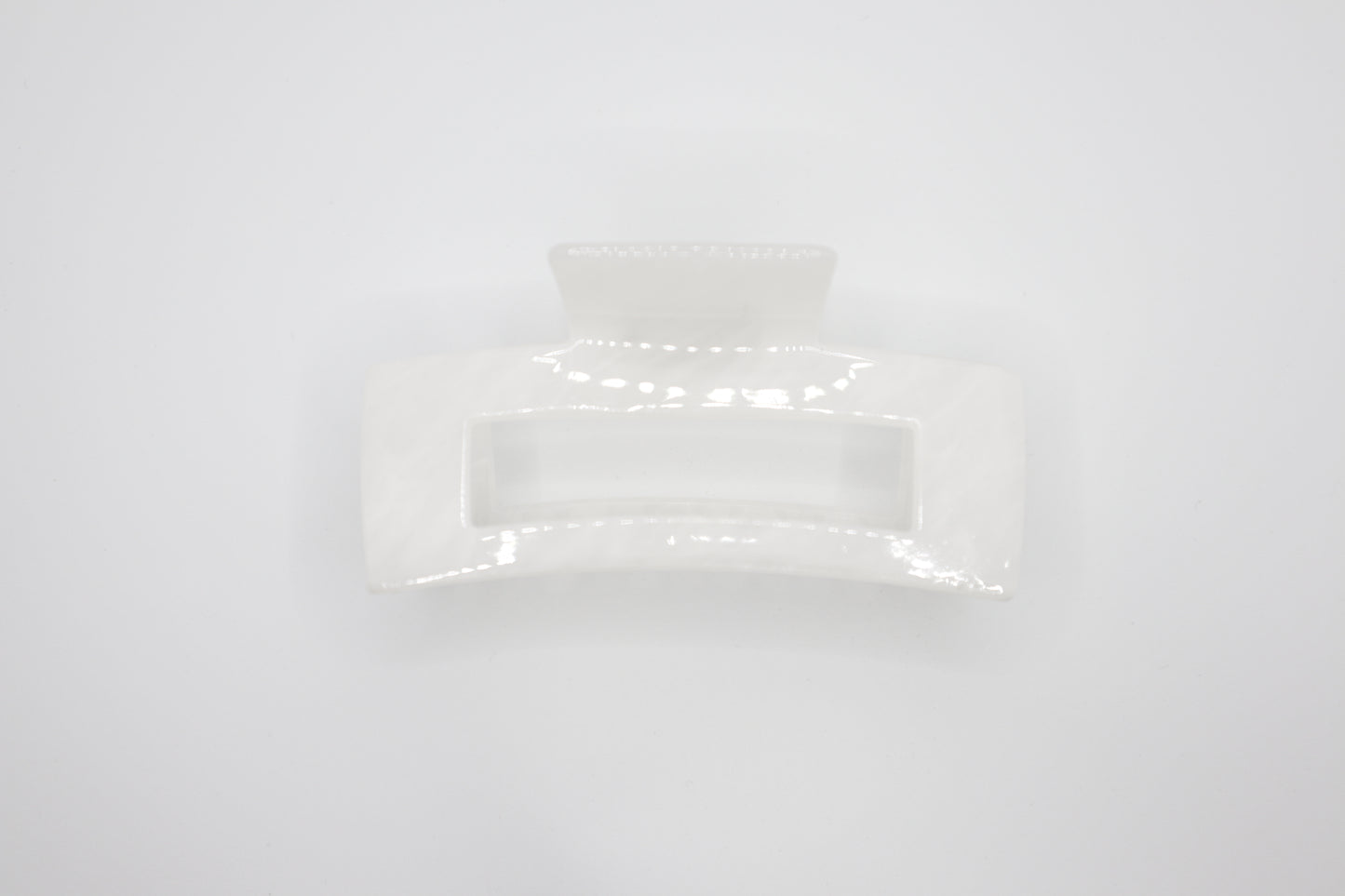Rectangular white Hair claw clip on a light gray background
